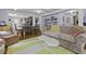 Spacious living room with modern decor and an open layout, ideal for both relaxation and social gatherings at 4971 Edge Ave, Charleston, SC 29405