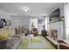 Comfortable living room with a stylish rug, fireplace, and ample natural light, providing a relaxing atmosphere at 4971 Edge Ave, Charleston, SC 29405