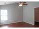 Clean bedroom with ceiling fan, natural light, and a closet at 518 Antebellum Ln, Mount Pleasant, SC 29464