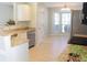 Well-lit kitchen with stainless steel appliances, light countertops, and tile flooring at 518 Antebellum Ln, Mount Pleasant, SC 29464