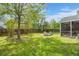 Lush backyard featuring a patio with fire pit, grilling area and privacy fence at 5224 Stonewall Dr, Summerville, SC 29485