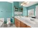 Bright bathroom features dual sinks, a vanity, and a toilet at 5224 Stonewall Dr, Summerville, SC 29485