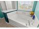 Bright bathroom offers large soaking tub at 5224 Stonewall Dr, Summerville, SC 29485