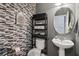 Tastefully decorated half-bathroom featuring modern fixtures, stylish tiling, and convenient storage at 5224 Stonewall Dr, Summerville, SC 29485