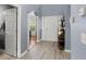 Spacious foyer highlighting hardwood floors, elegant columns, and abundant natural light at 5224 Stonewall Dr, Summerville, SC 29485