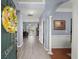 Welcoming foyer showcasing hardwood floors, elegant columns, and an open view into other rooms at 5224 Stonewall Dr, Summerville, SC 29485