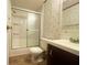 Bathroom with shower, floral wallpaper, vanity, and toilet at 570 Crystal Shores Dr, Moncks Corner, SC 29461