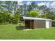 Backyard featuring a metal carport on a large grassy lot at 570 Crystal Shores Dr, Moncks Corner, SC 29461