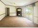 Inviting living room features a cozy fireplace, large sliding doors to the patio at 570 Crystal Shores Dr, Moncks Corner, SC 29461