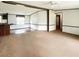 Spacious living area with carpet and ample natural light, awaiting your personal touch at 570 Crystal Shores Dr, Moncks Corner, SC 29461