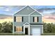 Charming two-story home with black shutters, a covered entryway, an attached garage, and blossoming flower beds at 6222 Gritman Dr, Hollywood, SC 29470