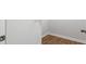 Image of a grey wall with a white door and a wood-look floor and white baseboards at 6254 Gritman Dr, Hollywood, SC 29470