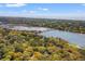 This aerial view showcases the surrounding landscape, with scenic views of a lagoon and golf course at 66 New Settlement Rd, Kiawah Island, SC 29455