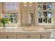 Bathroom vanity featuring granite counters and views from two windows at 66 New Settlement Rd, Kiawah Island, SC 29455