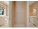 Bathroom featuring dual vanities and linen wallpaper at 66 New Settlement Rd, Kiawah Island, SC 29455