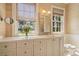 Bathroom vanity features granite counters and a window with water views at 66 New Settlement Rd, Kiawah Island, SC 29455