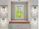 Bedroom window seat featuring storage and sconces at 66 New Settlement Rd, Kiawah Island, SC 29455