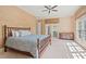 Bedroom with natural light, ceiling fan, textured walls, and wooden bamboo bed frame at 66 New Settlement Rd, Kiawah Island, SC 29455
