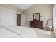 Comfortable bedroom with natural light, dresser, chair, and view of the hallway at 66 New Settlement Rd, Kiawah Island, SC 29455