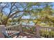 Relax on this deck overlooking scenic views of trees and the waterfront at 66 New Settlement Rd, Kiawah Island, SC 29455