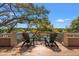 Relaxing deck with scenic waterfront views, featuring comfortable Adirondack chairs and beautiful trees at 66 New Settlement Rd, Kiawah Island, SC 29455