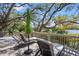 Comfortable lounge chairs on a wooden deck with a grill, overlooking the water at 66 New Settlement Rd, Kiawah Island, SC 29455