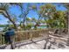 Spacious wooden deck offering water views, equipped with outdoor seating and a grill at 66 New Settlement Rd, Kiawah Island, SC 29455