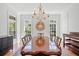 Elegant dining room with a long wood table, seating for ten, and hardwood floors at 66 New Settlement Rd, Kiawah Island, SC 29455