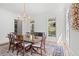 Formal dining room with wood floors, wainscoting, and seating for six guests at 66 New Settlement Rd, Kiawah Island, SC 29455