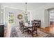 Bright and airy dining room featuring a large table, decorative chandelier, and natural light at 66 New Settlement Rd, Kiawah Island, SC 29455
