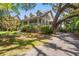 Beautiful two-story home with covered front porch, mature landscaping, and a welcoming facade at 66 New Settlement Rd, Kiawah Island, SC 29455