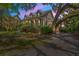 Charming two-story home with a covered front porch and lush landscaping in a serene neighborhood at 66 New Settlement Rd, Kiawah Island, SC 29455