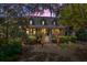 Inviting home exterior featuring manicured landscaping, a charming front porch, and mature trees at 66 New Settlement Rd, Kiawah Island, SC 29455