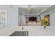 Bright kitchen featuring a large island with a marble countertop and stainless steel sink and faucet at 66 New Settlement Rd, Kiawah Island, SC 29455