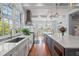 Spacious white kitchen with stainless steel appliances, large windows, and ample counter space at 66 New Settlement Rd, Kiawah Island, SC 29455