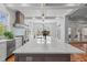 Kitchen featuring a large island with a marble countertop and seating for several people at 66 New Settlement Rd, Kiawah Island, SC 29455