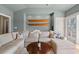 Comfortable living room boasting a sectional sofa, complemented by hardwood floors and natural light at 66 New Settlement Rd, Kiawah Island, SC 29455