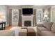 Inviting living room with a fireplace, hardwood floors, and a comfortable sectional sofa at 66 New Settlement Rd, Kiawah Island, SC 29455