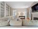 Cozy living room featuring custom built-ins, a sectional sofa, and a fireplace at 66 New Settlement Rd, Kiawah Island, SC 29455