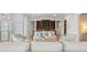Inviting living room with hardwood floors, coffered ceilings, and custom built-in shelving at 66 New Settlement Rd, Kiawah Island, SC 29455