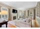 Comfortable living room featuring a fireplace, hardwood floors, and a large sectional sofa at 66 New Settlement Rd, Kiawah Island, SC 29455