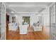 Open living room with french doors, hardwood floors, and stylish seating at 66 New Settlement Rd, Kiawah Island, SC 29455