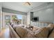 Inviting living room featuring a sectional sofa, deck access with outdoor seating and scenic views at 66 New Settlement Rd, Kiawah Island, SC 29455