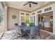 Charming screened-in patio with outdoor furniture, seamlessly blending indoor comfort with outdoor living at 66 New Settlement Rd, Kiawah Island, SC 29455