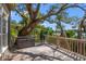 Outdoor patio with a grill, wicker table and lush scenery views for relaxing at 66 New Settlement Rd, Kiawah Island, SC 29455