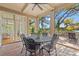 Outdoor patio with a round table and chairs perfect for entertaining with views of the lush landscape at 66 New Settlement Rd, Kiawah Island, SC 29455