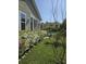 Charming backyard with blooming azaleas and mature landscaping at 711 Farm Cottage Ln, Charleston, SC 29412