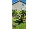 Landscaped backyard of a home with lush tropical plants and flowers at 711 Farm Cottage Ln, Charleston, SC 29412