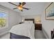 Comfortable bedroom featuring a queen-size bed, nightstands with lamps, and a ceiling fan at 711 Farm Cottage Ln, Charleston, SC 29412