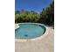 Inviting backyard featuring a sparkling pool and lush landscaping creating a serene and private outdoor space at 711 Farm Cottage Ln, Charleston, SC 29412
